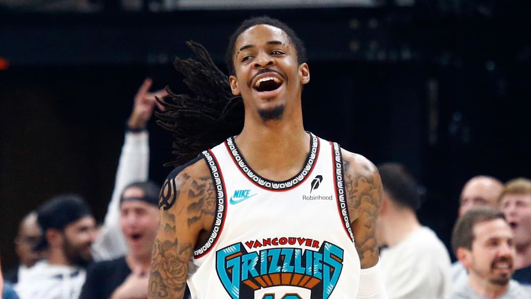 Apr 18, 2025; Memphis, Tennessee, USA; Memphis Grizzlies guard Ja Morant (12) reacts during the first quarter against the Dallas Mavericks at FedExForum. Mandatory Credit: Petre Thomas-Imagn Images