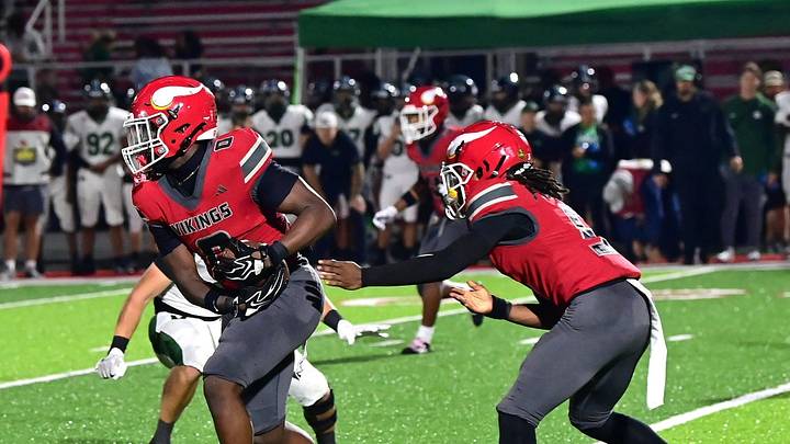 Key'Sean Torbert (5) makes a clean handoff to Jordan Hall (0) for Princeton during the Greater Miami Conference football game between Mason and Princeton on Friday, Oct. 2, 2026.