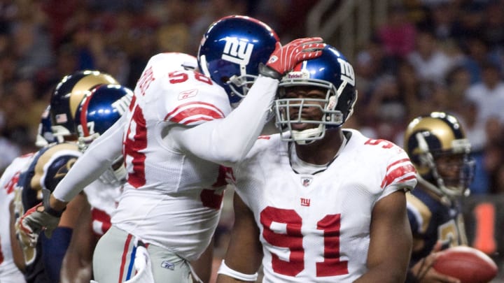 September 14, 2008; St, Louis, MO, USA; New York Giants defensive end Justin Tuck (91) is congratulated by linebacker Antonio Pierce (58) after sacking St. Louis Rams quarterback Marc Bulger (10) (not pictured) in the second half at the Edward Jones Dome. Mandatory Credit: Jeff Curry-USA TODAY Sports