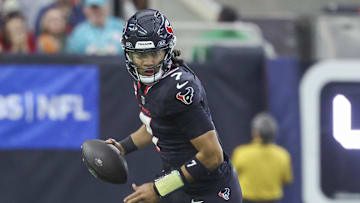 Dec 15, 2024; Houston, Texas, USA; Houston Texans quarterback C.J. Stroud (7) in action during the game against the Miami Dolphins at NRG Stadium. Mandatory Credit: Troy Taormina-Imagn Images