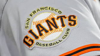 The San Francisco Giants logo on the sleeve of a player during a game. 