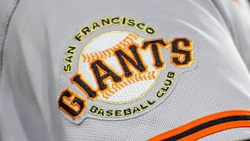 The San Francisco Giants logo on the sleeve of a player during a game. 