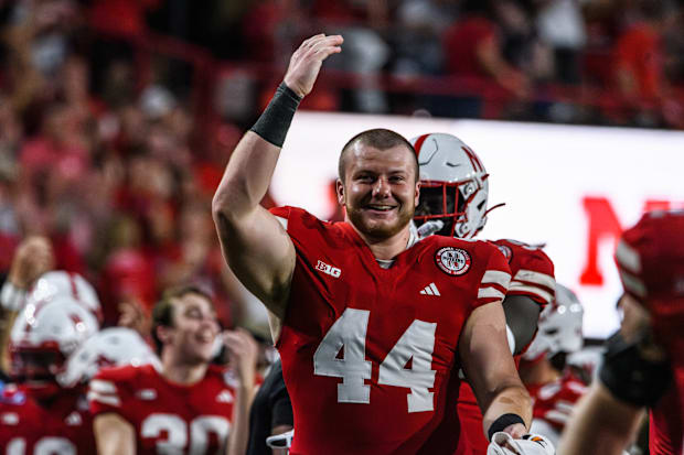 Defensive lineman Riley Van Poppel celebrates a Nebraska fumble recovery against Illinois. 