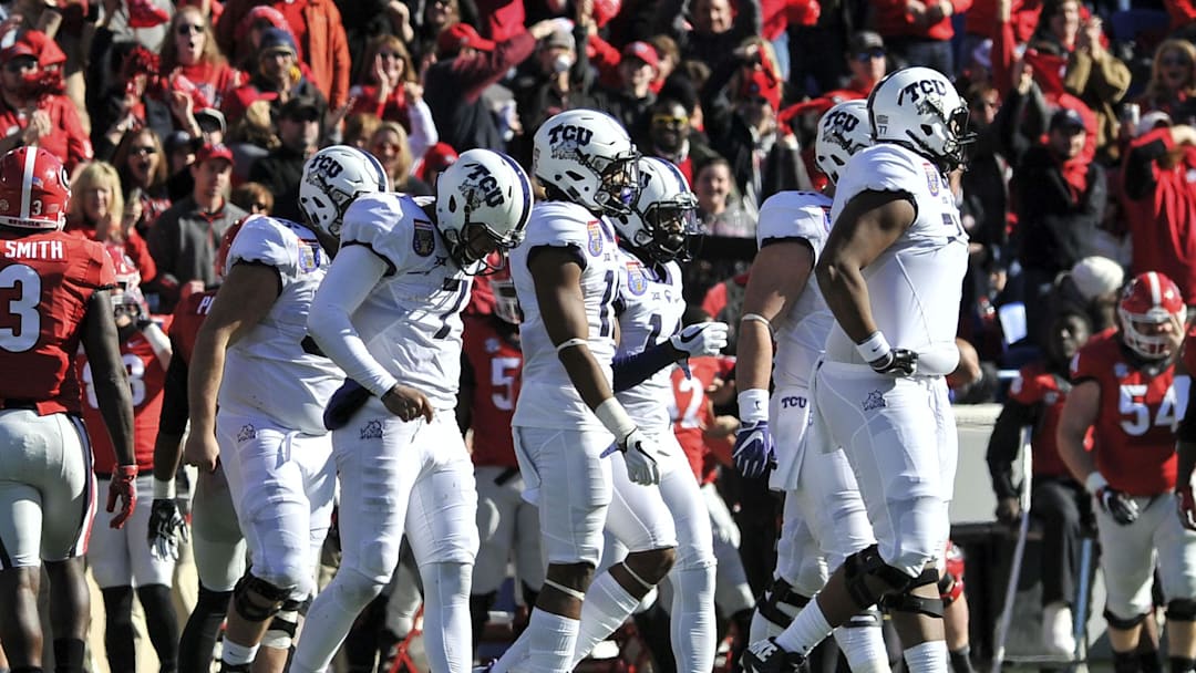 Dec 30, 2016; Memphis, TN, USA; TCU Horned Frogs quarterback Kenny Hill (7) walks off the field during the first half against the Georgia Bulldogs at Liberty Bowl. Mandatory Credit: Justin Ford-Imagn Images