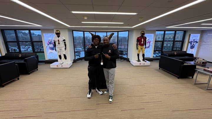 2027 Boston College running back target Kennie Leggett alongside Eagles' assistant coach Savon Huggins 2027 Boston College running back target Kennie Leggett alongside Eagles' assistant coach Savon Huggins