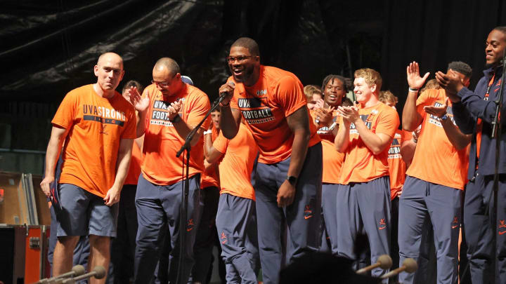 Chico Bennett Jr. addresses the crowd on the Downtown Mall during the Virginia football Paint the Town Orange pep rally.