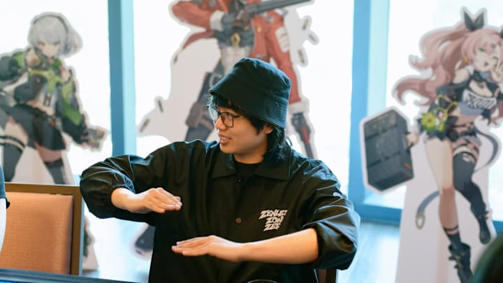 Zenless Zone Zero producer Zhenyu Li explaining something.