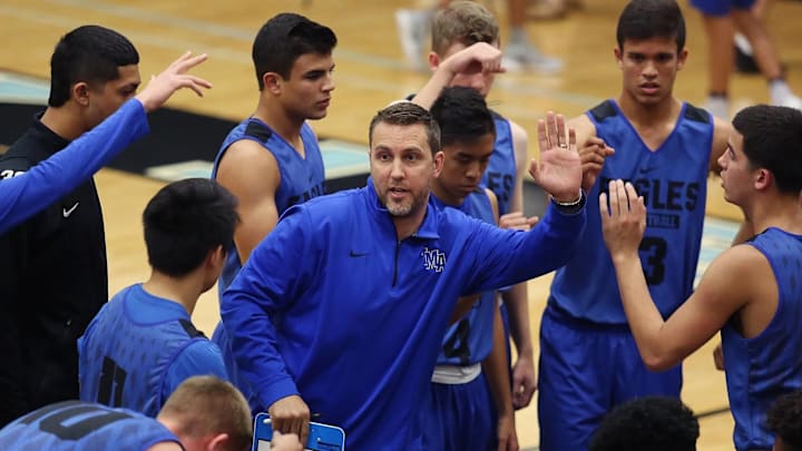 The Master's Academy Head Coach Reggie Kohn giving his team a pregame huddle