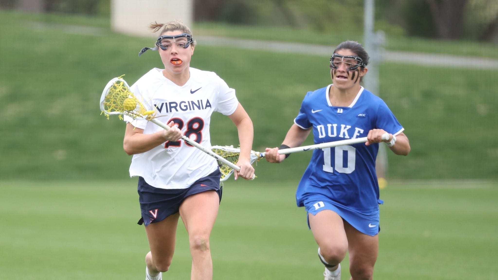 Maggie Bostain clears the ball during the Virginia women's lacrosse game against Duke.