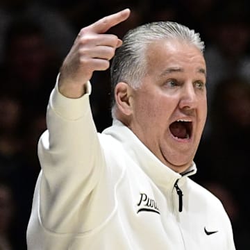 Purdue Boilermakers head coach Matt Painter motions toward his team