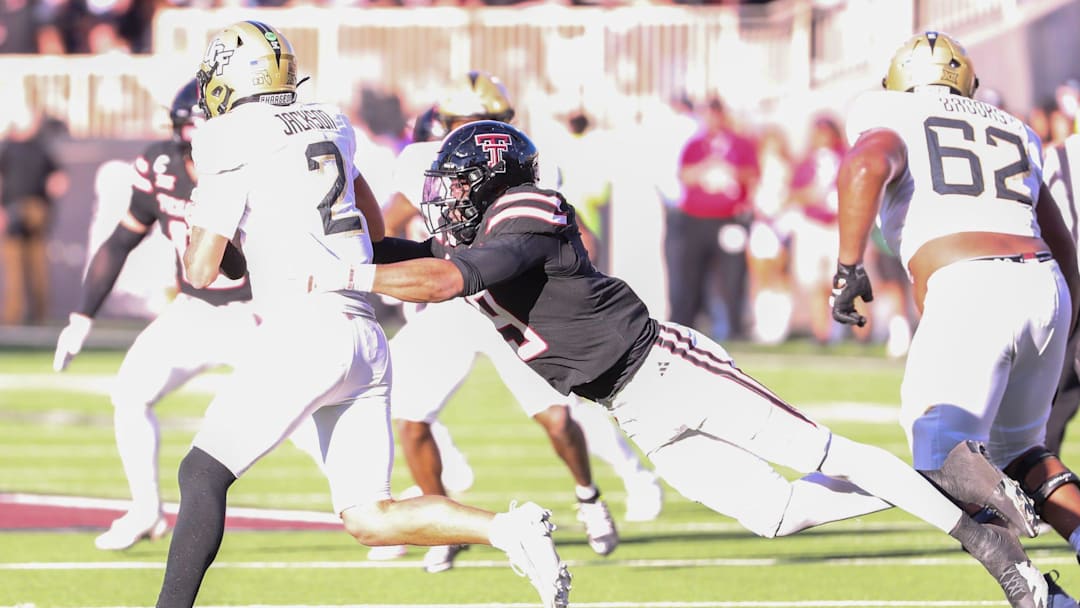 Texas Tech's Romello Height sacks UCF quarterback Tayven Jackson during a Big 12 Conference football game, Saturday, Nov. 15, 2025, at Jones AT&T Stadium.