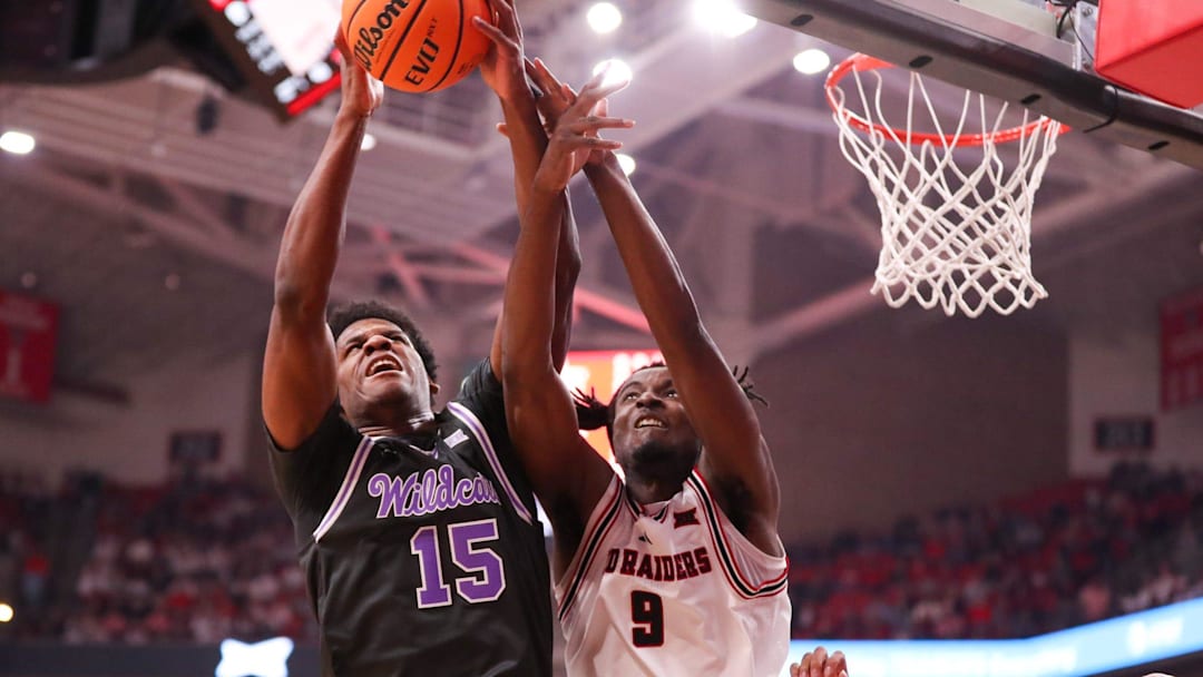 Kansas State's Taj Manning battles Texas Tech's Luke Bamgboye for a rebound during a Big 12 Conference men's basketball game, Saturday, Feb. 21, 2026, in United Supermarkets Arena.