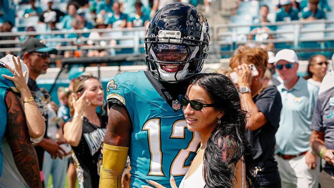 Sep 21, 2025; Jacksonville, Florida, USA; Jacksonville Jaguars player Travis Hunter (12) with his wife during pregame against the Houston Texans at EverBank Stadium.