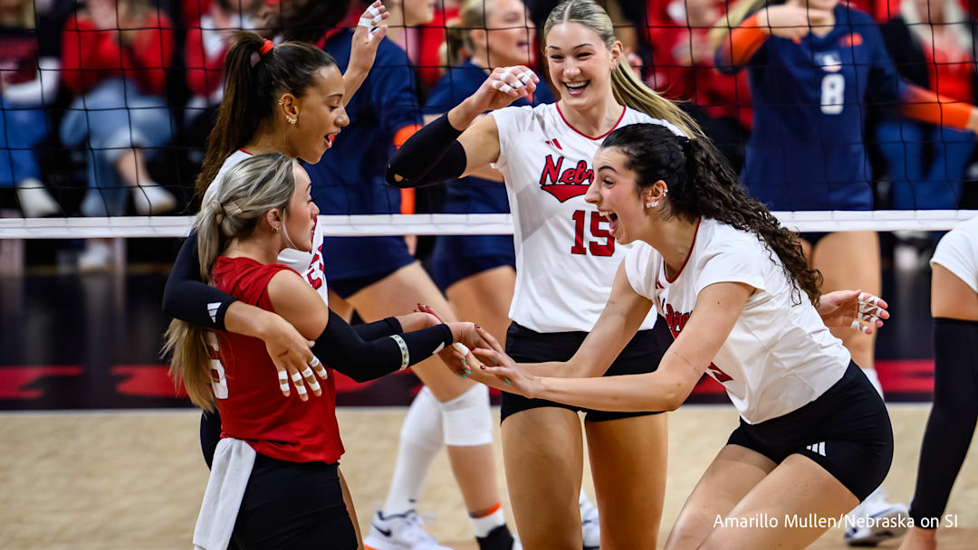 Virginia Adriano (right) high fives Laney Choboy (red) after a kill. Virginia Adriano (right) high fives Laney Choboy (red) after a kill.