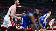 Jan 1, 2024; Los Angeles, California, USA; Los Angeles Clippers guard James Harden (1) looks to pass against Miami Heat forward Kevin Love (42) during the fourth quarter at Crypto.com Arena. Mandatory Credit: Jonathan Hui-Imagn Images