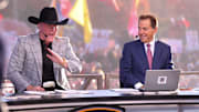 ESPN personality Pat McAfee talks during College GameDay as Nick Saban looks on at Jones AT&T Stadium.