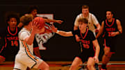 St. Cloud Tech boys basketball senior Gavin Gall plays defense during a game Dec. 28, 2024 against Hutchinson at Tech High School. The Tigers lost 50-47.