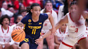 West Virginia's JJ Quinerly dribbles against Texas Tech during a Big 12 Conference women's basketball game, Wednesday, Jan. 8, 2025, in United Supermarkets Arena.
