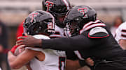 Lee Hunter wraps up Quinten Joyner for a tackle during the Texas Tech football team's spring game.