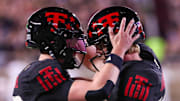 Texas Tech's Will Hammond (right) celebrates a touchdown with Mitch Griffis against Kansas during a Big 12 Conference football game, Saturday, Oct. 11, 2025, at Jones AT&T Stadium in Lubbock.