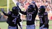 Texas Tech's Jacob Rodriguez (10) gestures to the crowd after making an interception against UCF during a Big 12 Conference football game.