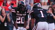 Texas Tech's Reggie Virgil celebrates his touchdown with J'Koby Williams during a Big 12 Conference football game, Saturday, Nov. 15, 2025, at Jones AT&T Stadium.