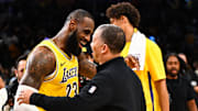 Nov 1, 2023; Los Angeles, California, USA; Los Angeles Lakers forward LeBron James (23) embraces head coach Tyronn Lue of the LA Clippers after the Lakers won during overtime at Crypto.com Arena. Mandatory Credit: Jonathan Hui-Imagn Images