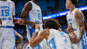 North Carolina Seth Trimble getting helped up by teammates Caleb Wilson (8) and Kyan Evans (0) during North Carolina's exhibition game against Winston-Salem State on Oct. 29, 2025.