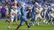 North Carolina quarterback Gio Lopez attempting to throaw a pass during Tar Heels' 20-15 win over Stanford on Nov. 8, 2025.