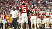 Kalen DeBoer hugs Alabama DB Dijon Lee in warmups