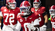 Alabama linebacker Deontae Lawson runs onto the field for the SEC Championship on Dec. 6, 2025.