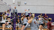 Boston College Volleyball junior Opposite Hitter Sam Hoppes jumps for a hit in earlier action.