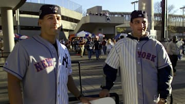 Baseball fans Steven Filipe (L) and Anthony Crocit