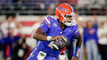 Nov 1, 2025; Jacksonville, Florida, USA; Florida Gators quarterback DJ Lagway (2) scrambles with the ball against the Georgia Bulldogs at EverBank Stadium. Mandatory Credit: Travis Register-Imagn Images