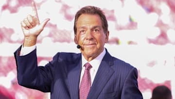 ESPN personality Nick Saban does the Guns Up gesture toward Texas Tech students before a Big 12 Conference football game, Saturday, Nov. 8, 2025, at Jones AT&T Stadium.