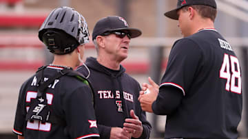 Texas Tech head coach Tim Tadlock (center) talks to Mac Heuer and Dylan Maxcey during a Big 12 baseball game, Friday, April 4, 2025, at Dan Law Field.