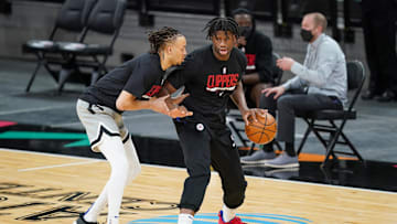 Mar 25, 2021; San Antonio, Texas, USA; Los Angeles Clippers guard Amir Coffey (7) and center Daniel Oturu (10) warm up before the game against the San Antonio Spurs at the AT&T Center. Mandatory Credit: Daniel Dunn-Imagn Images