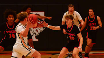 St. Cloud Tech boys basketball senior Gavin Gall plays defense during a game Dec. 28, 2024 against Hutchinson at Tech High School. The Tigers lost 50-47.