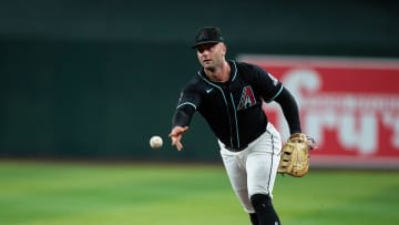 Arizona Diamondbacks first baseman Christian Walker (53) tosses the ball to first after fielding a sharp ground ball on July 27, 2024 at Chase Field in Phoenix.