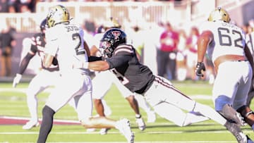 Texas Tech's Romello Height sacks UCF quarterback Tayven Jackson during a Big 12 Conference football game, Saturday, Nov. 15, 2025, at Jones AT&T Stadium.