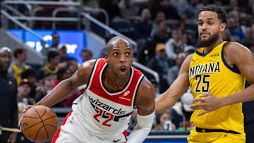 Nov 28, 2025; Indianapolis, Indiana, USA;  Washington Wizards forward Khris Middleton (22) dribbles the ball while  Indiana Pacers forward Jeremiah Robinson-Earl (25) defends in the second half at Gainbridge Fieldhouse. Mandatory Credit: Trevor Ruszkowski-Imagn Images