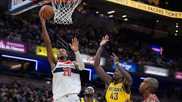 Nov 28, 2025; Indianapolis, Indiana, USA; Washington Wizards center Alex Sarr (20) shoots the ball while Indiana Pacers forward Pascal Siakam (43) defends in the second half at Gainbridge Fieldhouse. Mandatory Credit: Trevor Ruszkowski-Imagn Images
