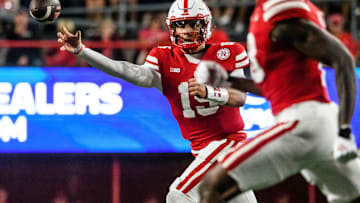 Dylan Raiola (15) makes a pass intended for Isaiah Neyor.  