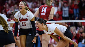Andi Jackson (15) and Merritt Beason celebrate a double-stuff block. 
