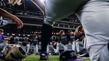 TCU Baseball team prays before final game of the season.