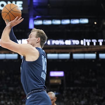 Jan 17, 2025; San Antonio, Texas, USA; Memphis Grizzlies guard Luke Kennard (10) shoots in the first half against the San Antonio Spurs at Frost Bank Center. Mandatory Credit: Daniel Dunn-Imagn Images