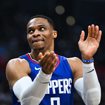 Jan 1, 2024; Los Angeles, California, USA; Los Angeles Clippers guard Russell Westbrook (0) reacts after a teammate scores against the Miami Heat during the third quarter at Crypto.com Arena. Mandatory Credit: Jonathan Hui-Imagn Images