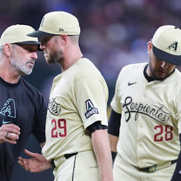 Arizona Diamondbacks pitcher Merrill Kelly (29) is taken out of the game by manager Torey Lovullo at Chase Field on Aug. 31, 2024, in Phoenix.