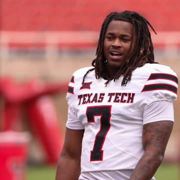 Tight ends Terrance Carter Jr. (right) and Johncarlos Miller II await the start of the Texas Tech football team's spring game, Saturday, April 19, 2025, at Jones AT&T Stadium.