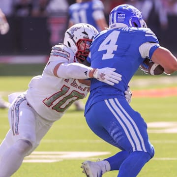Texas Tech's Jacob Rodriguez tackles BYU running back LJ Martin during a Big 12 Conference football game, Saturday at Jones AT&T Stadium.